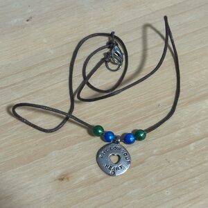 Silver pendant necklace with blue and green accents